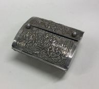 A heavy chased Indian silver box with hinged lid.
