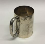 A heavy Edwardian tapering silver christening cup.
