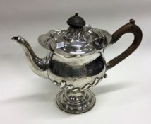 A small half fluted bachelor's silver teapot. Lond