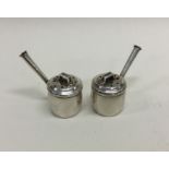 An unusual pair of toy silver watering cans. Chest