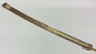 A silver gilt bracelet with concealed clasp. Appro