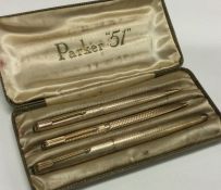 PARKER: A good set of three 9 carat pens with engi