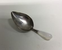 A George III silver caddy spoon. London 1796. Appr