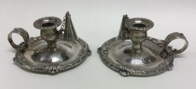 A pair of George III silver chambersticks. Each pi
