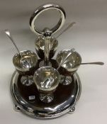 A rare Victorian silver mounted wooden egg cruet.