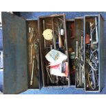 A fold-out tool box containing a quantity of tools