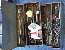 A fold-out tool box containing a quantity of tools