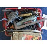 A quantity of hand tools including grease-guns and