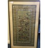 An Oriental silk tapestry. Approx. 64cms x 34cms.