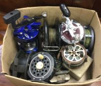 A box containing fishing reels.