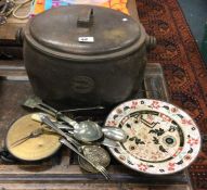 An old cast iron cooking pot etc.