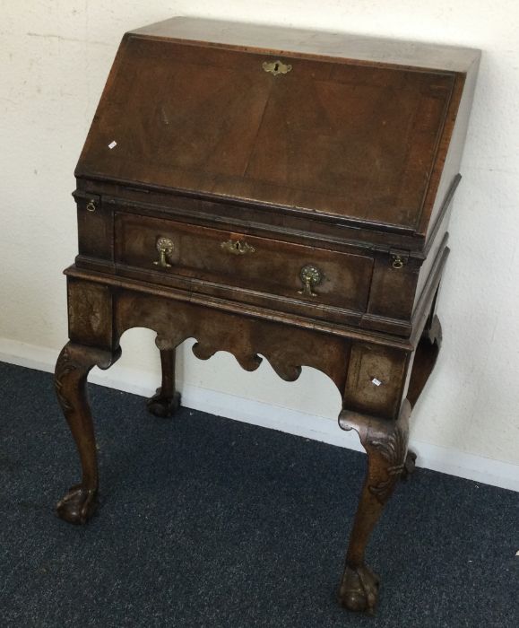 A Georgian style single drawer bureau.