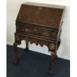 A Georgian style single drawer bureau.