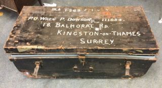An old tin trunk together with military contents.