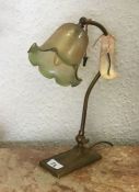 A green glass mounted table lamp.