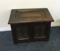 An Antique oak hinged top box.