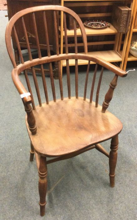 An antique bow back chair.