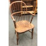 An antique bow back chair.