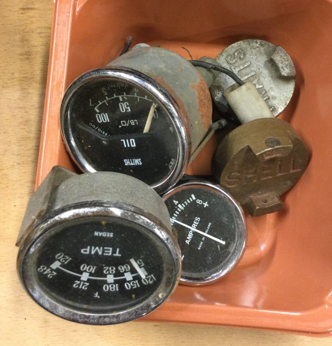 A collection of old car speedos/dials.