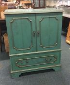 A painted T.V. cabinet.