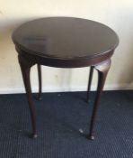 A small oak occasional table.