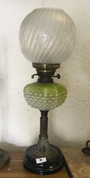 An etched glass oil lamp.