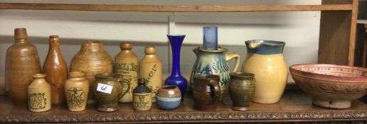 A collection of old stoneware bottles.