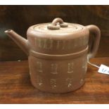 An Oriental terracotta teapot.