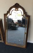 A large shaped mirror.