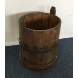 A large circular wooden pail.