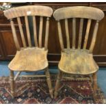 Two antique stick back chairs.
