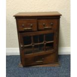 An oak single door stationary chest.