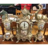 A good brass mounted clock garniture.