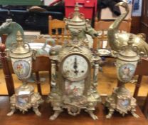 A good brass mounted clock garniture.