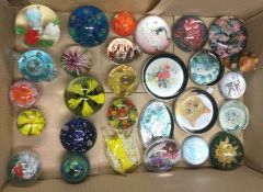 A collection of glass paperweights.