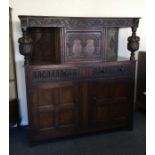 A large hinged top court cupboard.