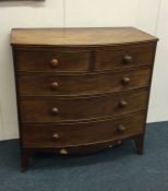 A Victorian mahogany bow front chest of drawers.