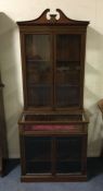 An attractive inlaid two section bookcase/display