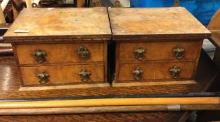 A pair of walnut miniature chests.