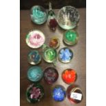 A collection of glass paperweights.