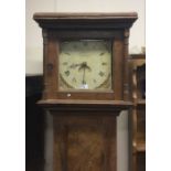 An antique elm Grandfather clock.