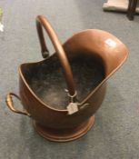 An old copper coal bucket.
