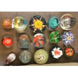 A collection of glass paperweights.