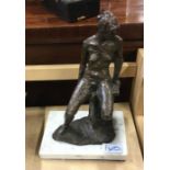 A spelter figure on square base.