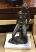 A spelter figure on square base.