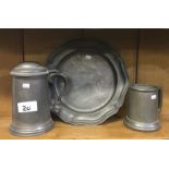 Two pewter tankards together with a pewter plate.