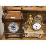 A mahogany clock together with one other.