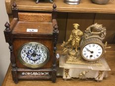 A mahogany clock together with one other.