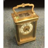 A brass mounted carriage clock.