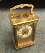 A brass mounted carriage clock.